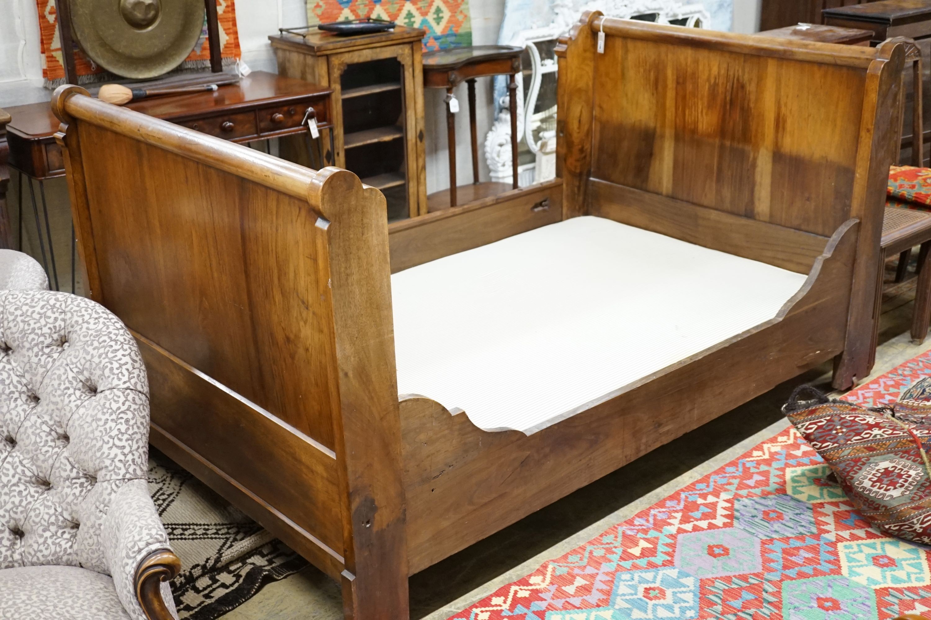 A 19th century Continental Gothic Revival mahogany sleigh bed, 209cm long, 126cm wide